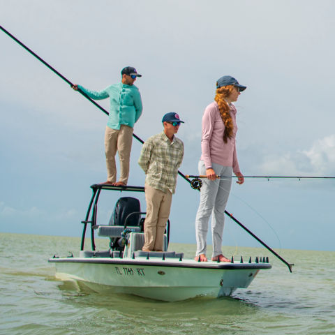 Three anglers fishing the flats from a poled boat